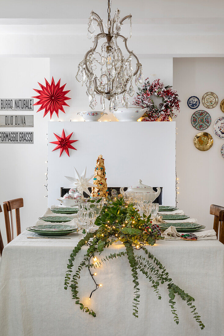 Festive dining table with Christmas decorations and fir branches