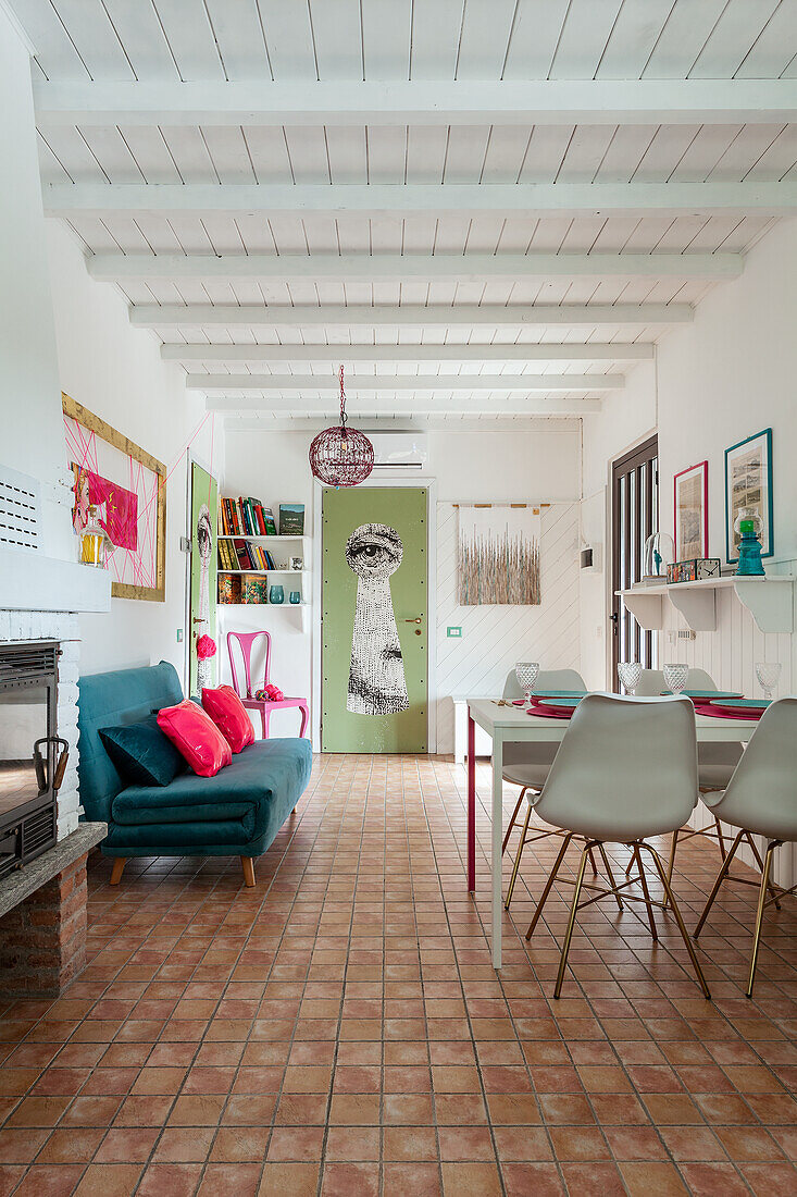 Open plan living room with terracotta colored tiles