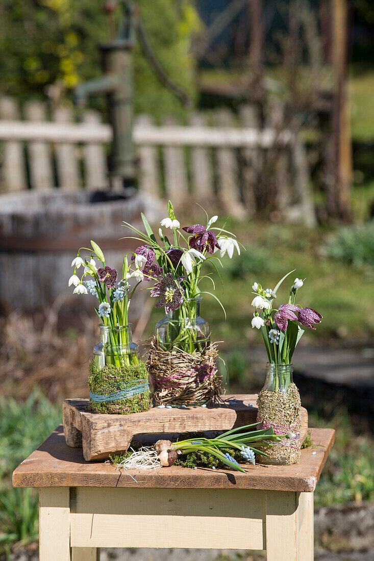 Bouquets of checkerboard flowers, grape hyacinths, cone flowers and snowdrops