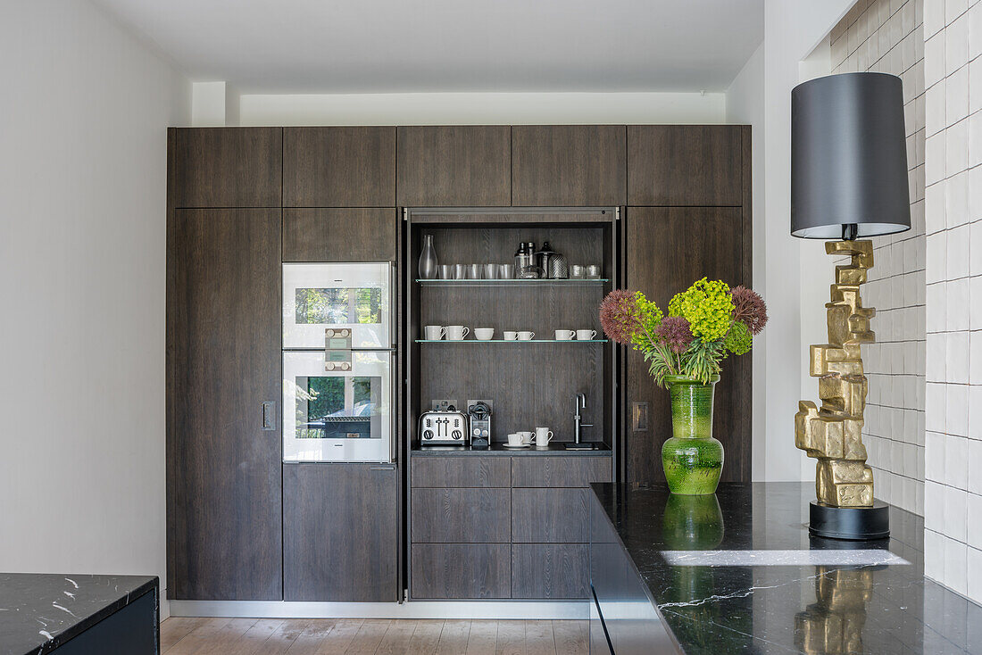 Built-in kitchen cupboard with integrated coffee bar