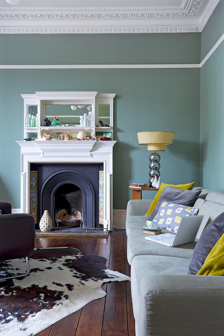 Open fireplace in the classic living room with a stucco ceiling