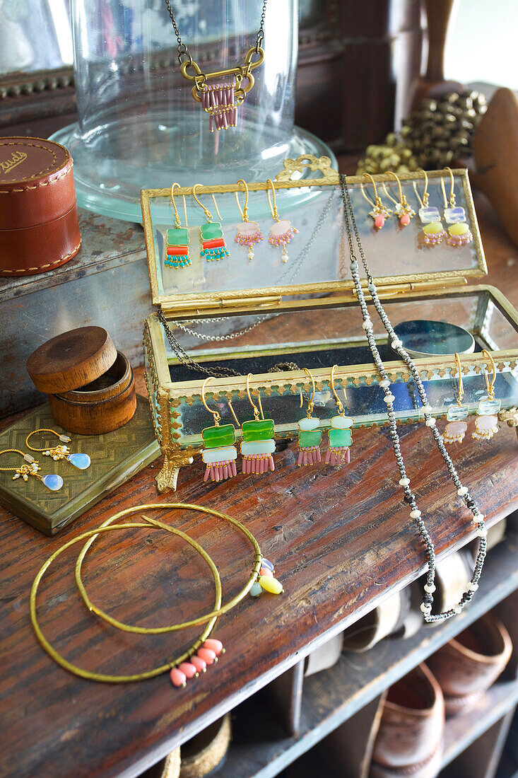 Earrings and nostalgic jewellery on a glass jewellery box