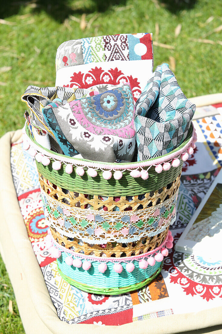 Basket decorated with pompom trim and lace ribbon