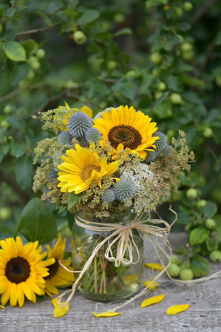 Late summer bouquet with sunflowers and globe thistles