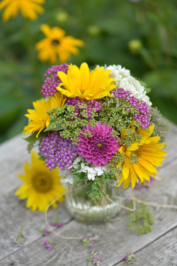 Colourful summer bouquet with sunflowers, dahlias, yarrow and hydrangea flowers