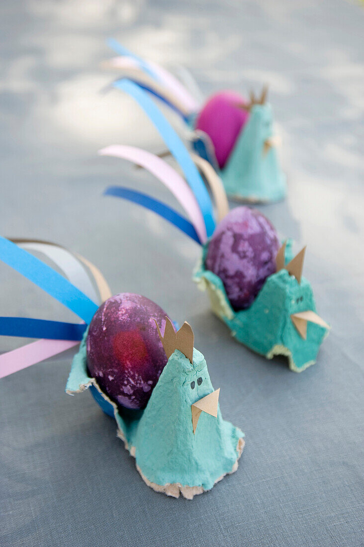 Easter decoration with dyed eggs and self-made egg cups