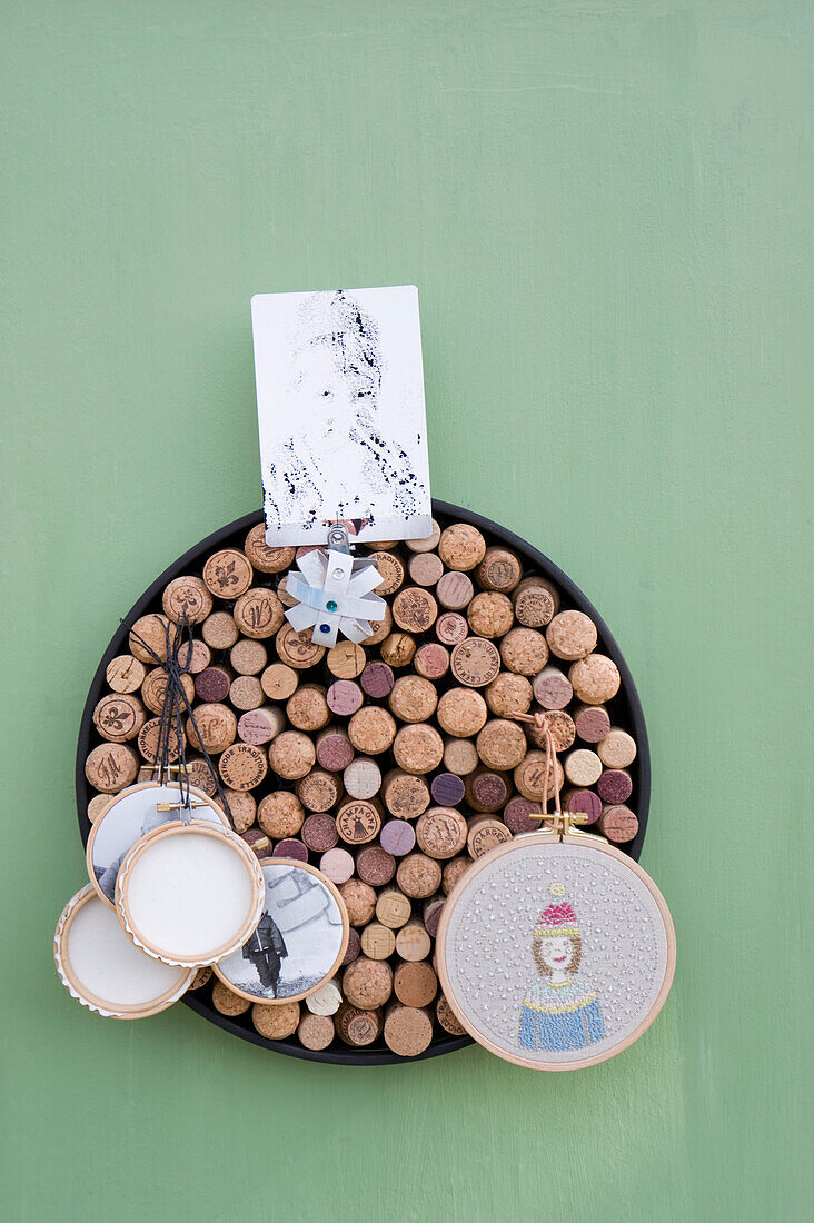 Upcycling, old corks, , pinboard with portrais and photos on canvas in embroidery frame