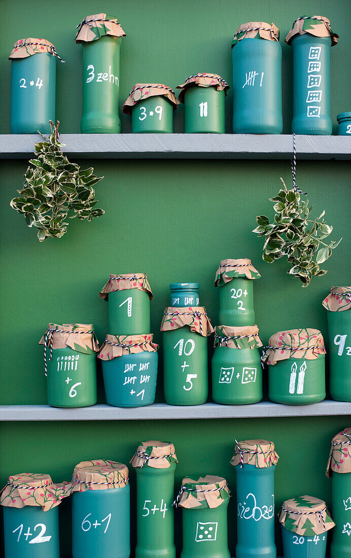 DIY green painted jars representing Advent Calendar