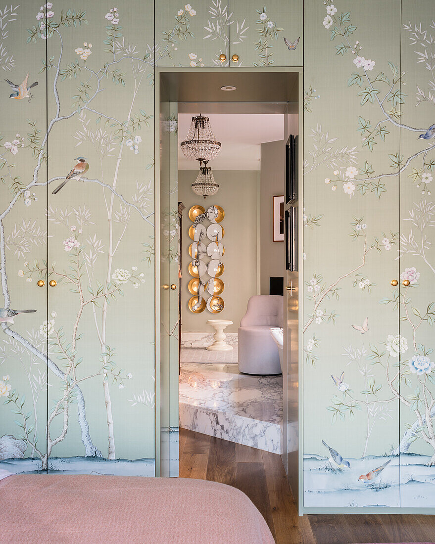 Chinoiserie wall paper covering wardrobe doors