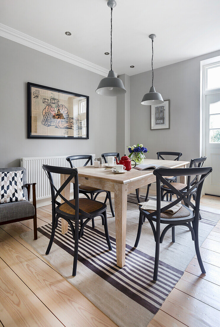Dining area in open kitchen with light grey walls