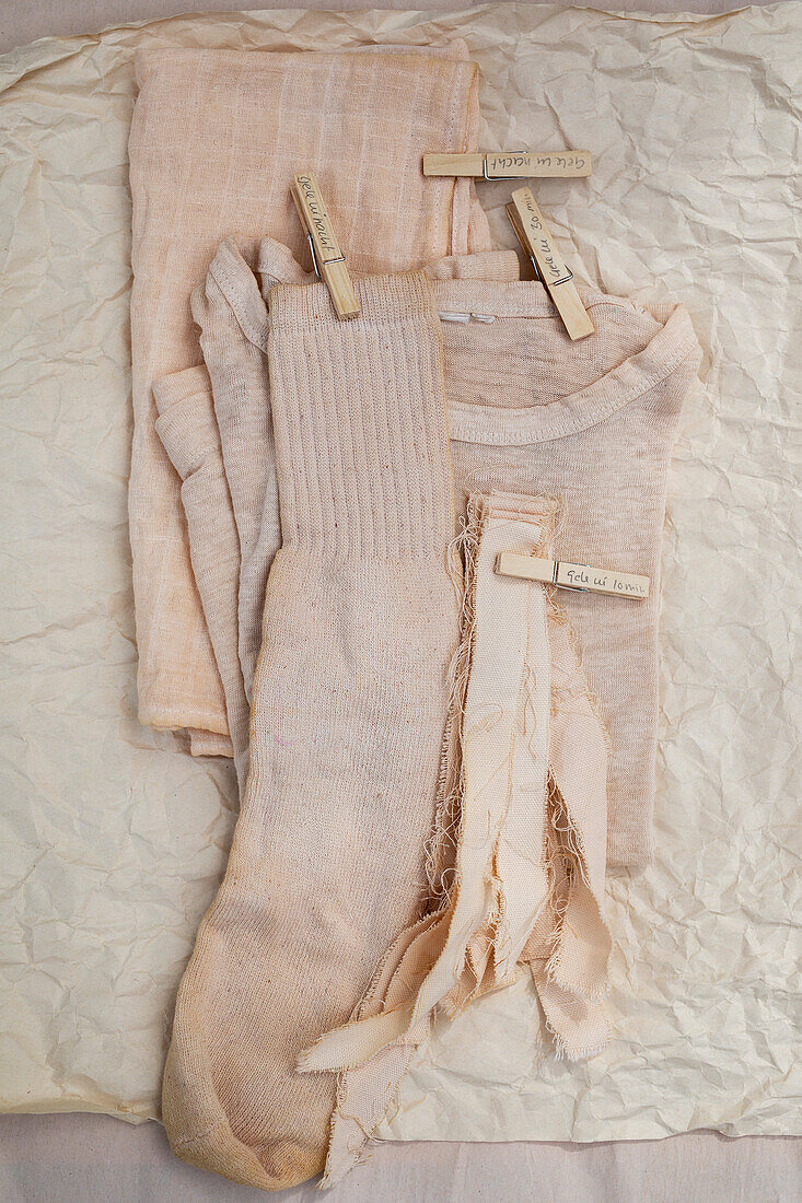 Fabrics, T-shirt and socks in beige, dyed with natural dye