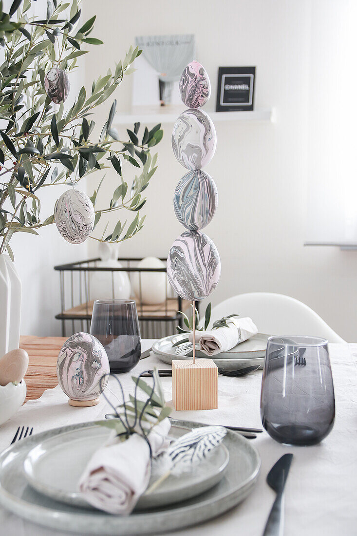 Easter decoration with marbled eggs on a modern table setting