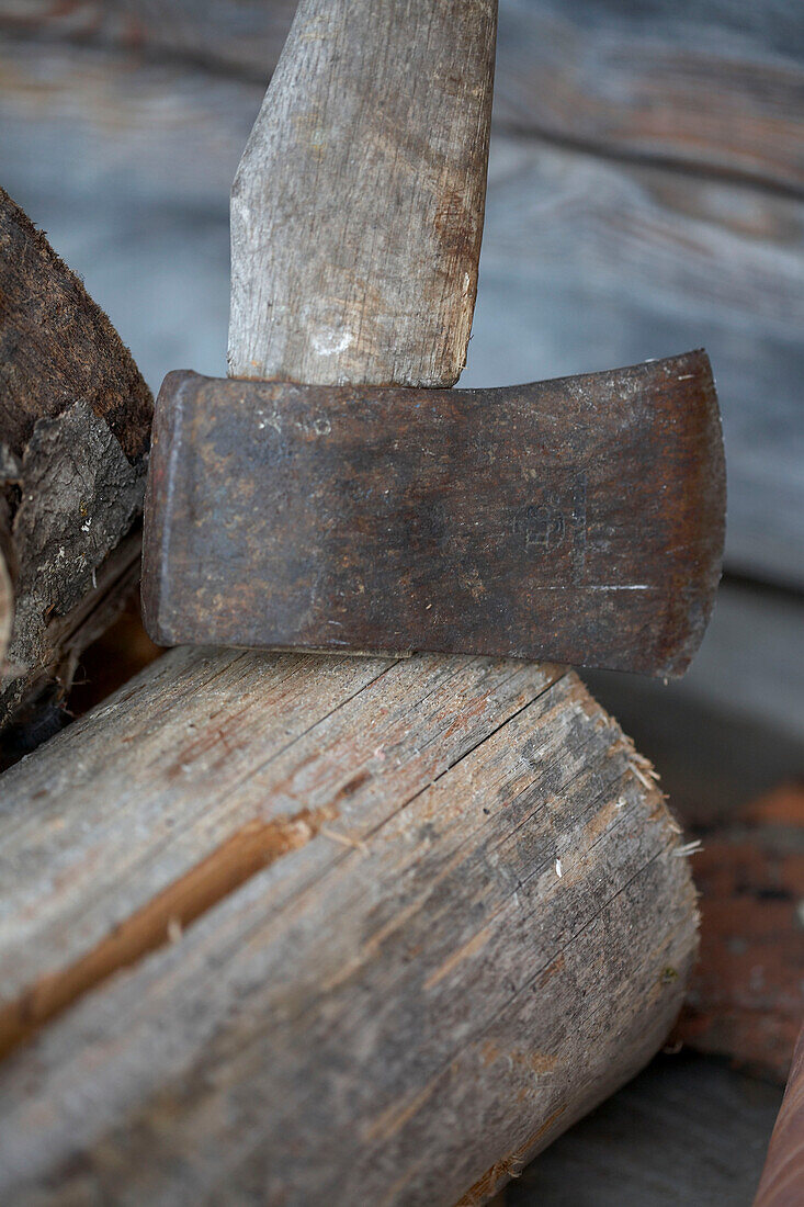 Metal axe and firewood in Svartadalen forest, Sweden
