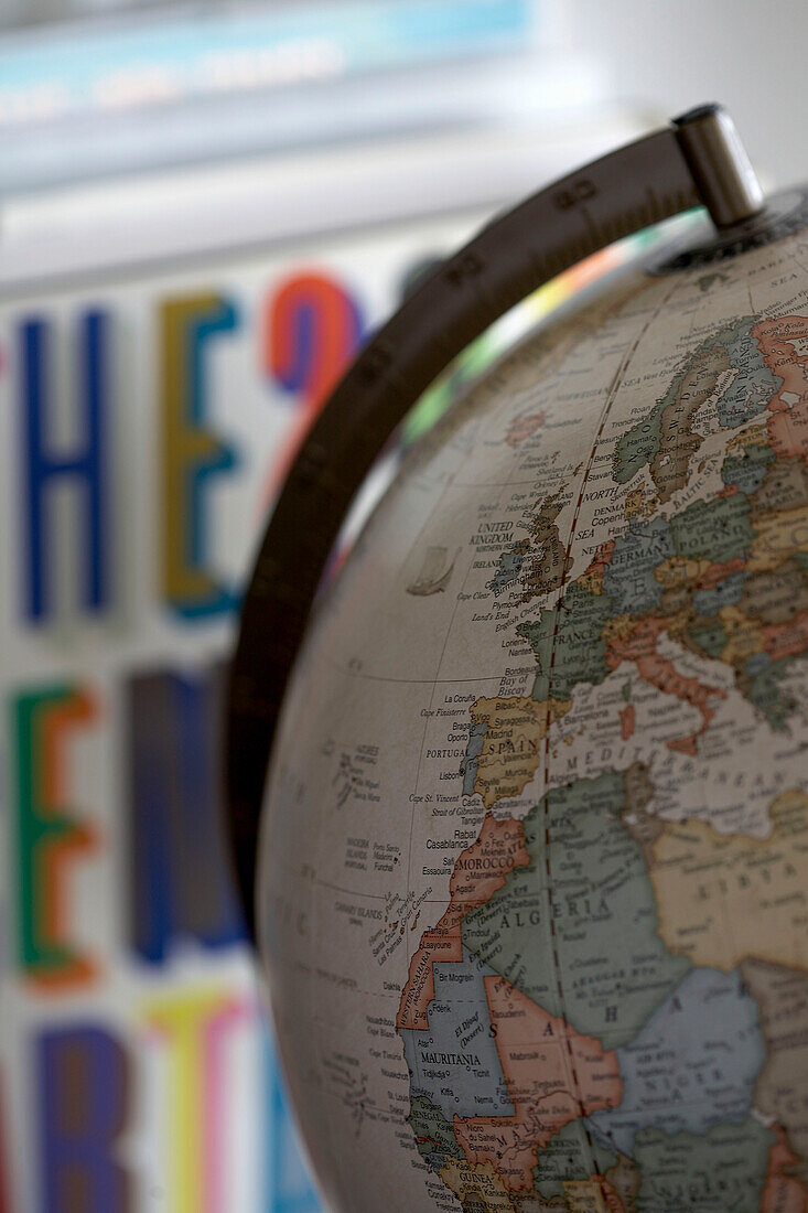 World globe and reference book in child's bedroom