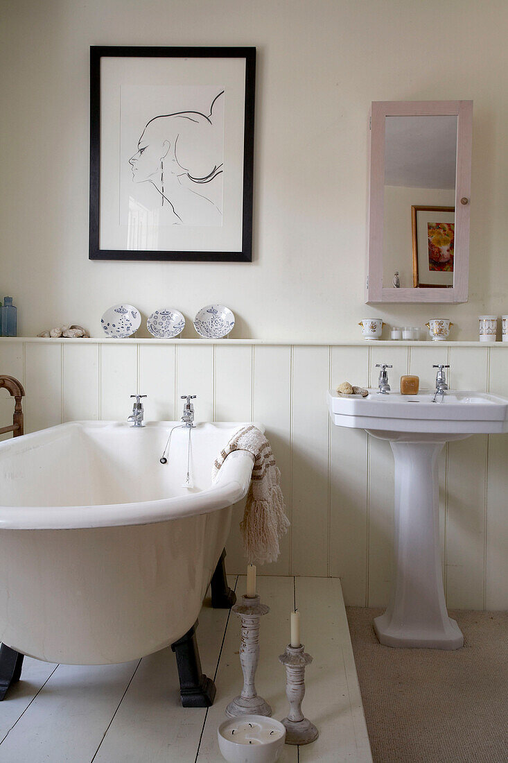Freestanding bath and artwork with panelled wall in Rye, Sussex