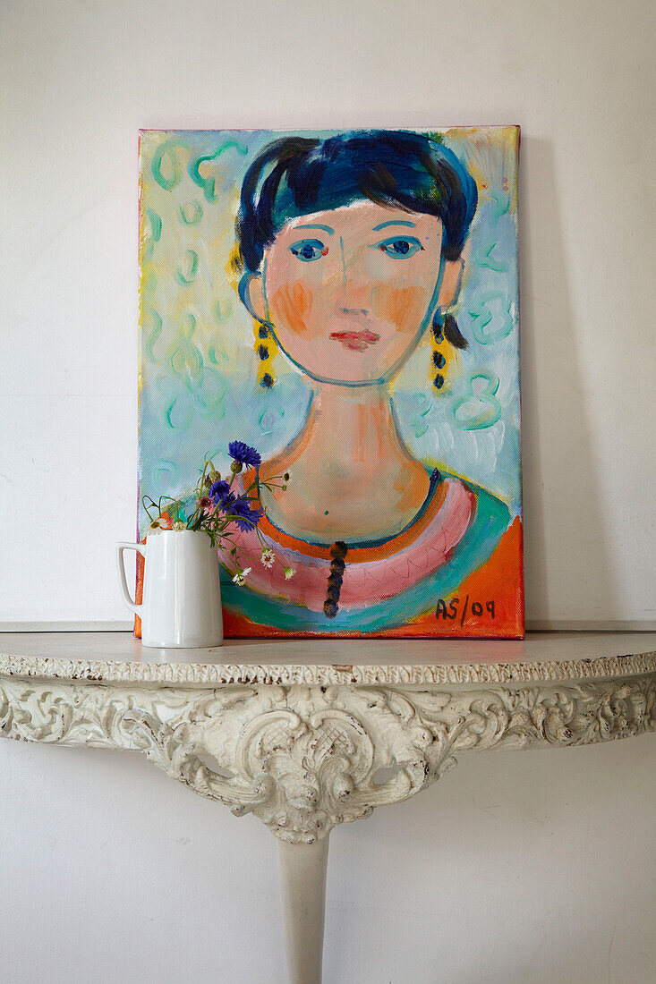 Portrait on canvas on carved semilune table