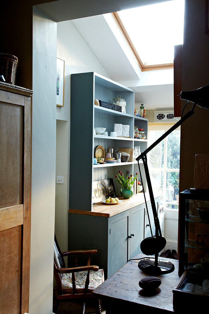 Desk lamp at kitchen doorway in Brighton home, Sussex, UK