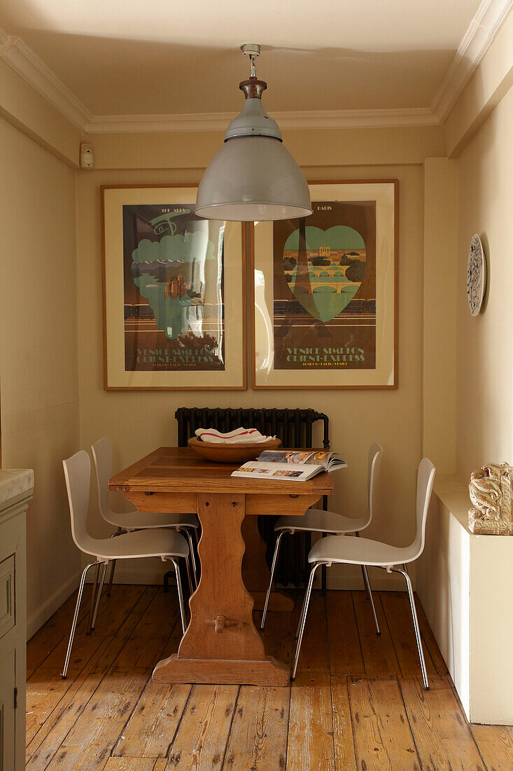 Recessed kitchen table with artwork in Brighton home, East Sussex, England, UK