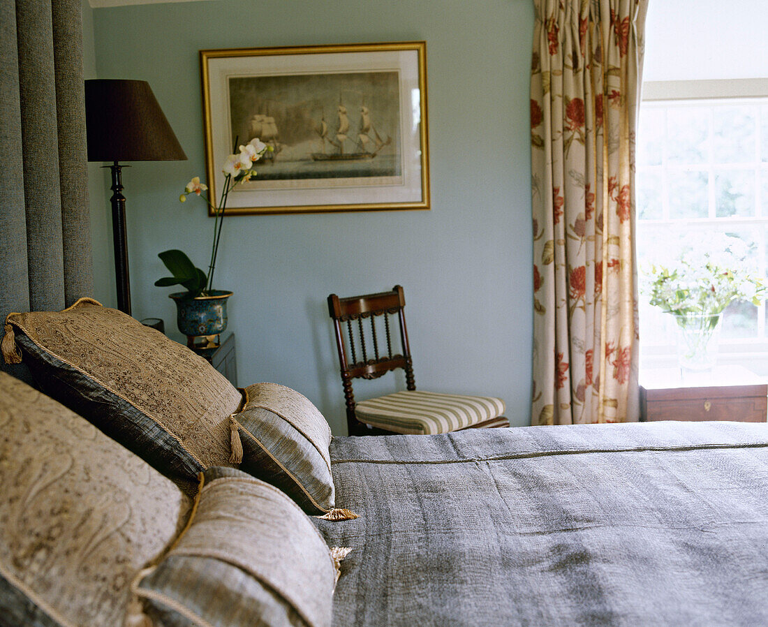 Double bed in blue green bedroom