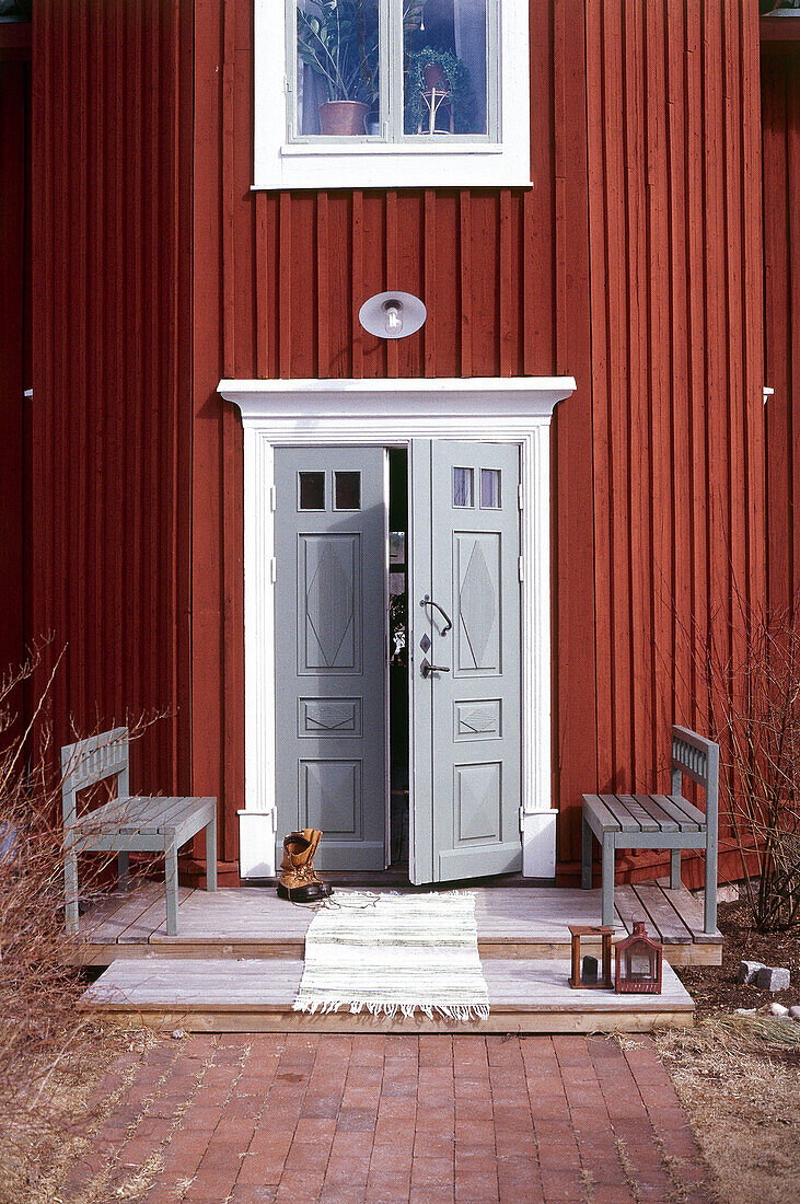 Front door entrance of traditionally Swedish timber house