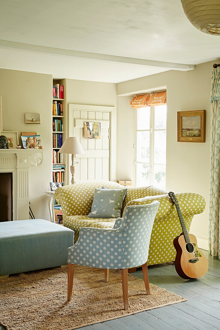 Upholstered chair in Cotswold home of textile designer, UK