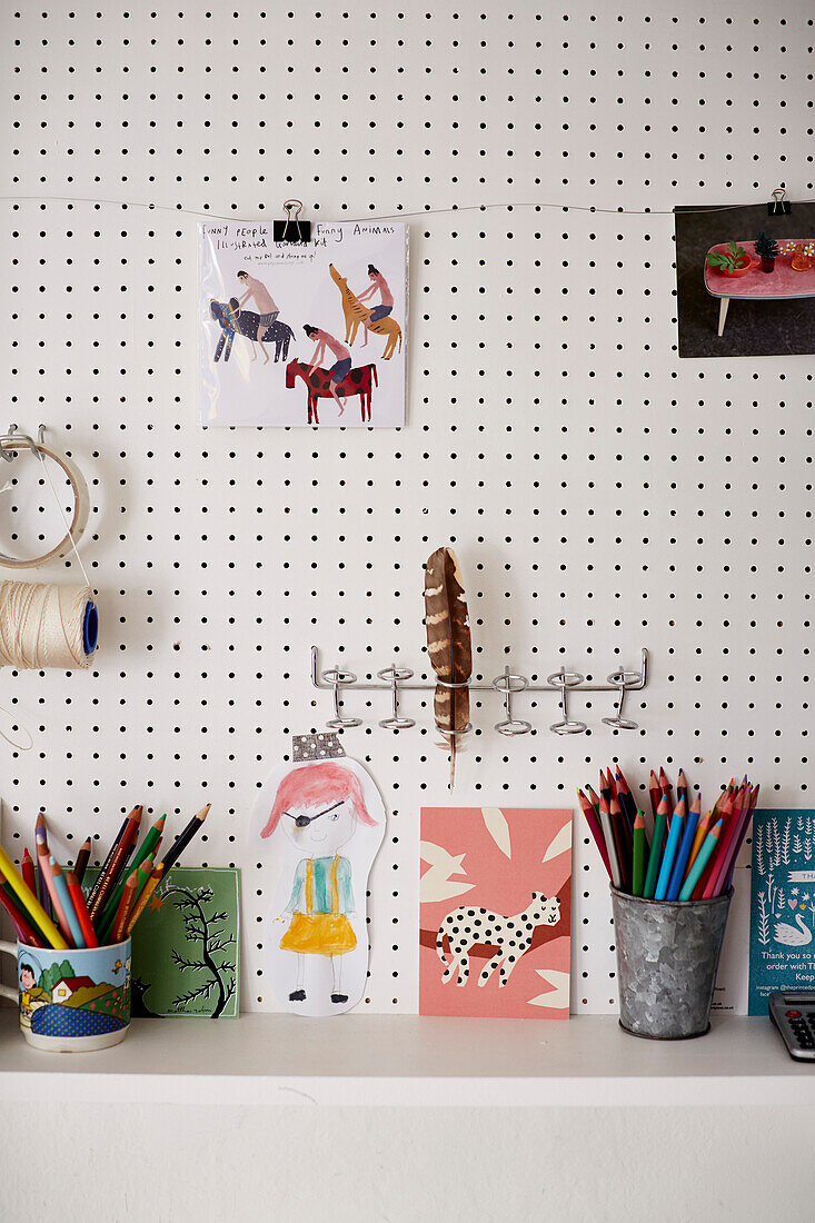 Pencils and postcards on artisan's desk Bridport, Dorset, UK