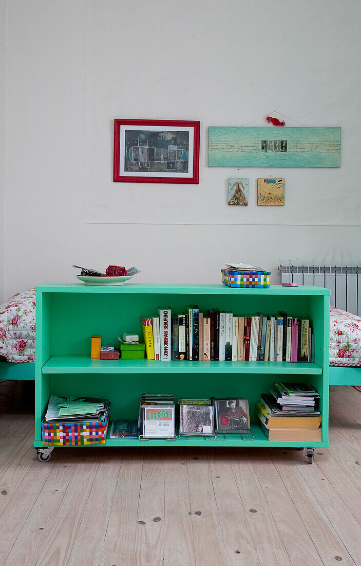 Bookshelf in front of bed in modern apartment Buenos Aires, Argentina