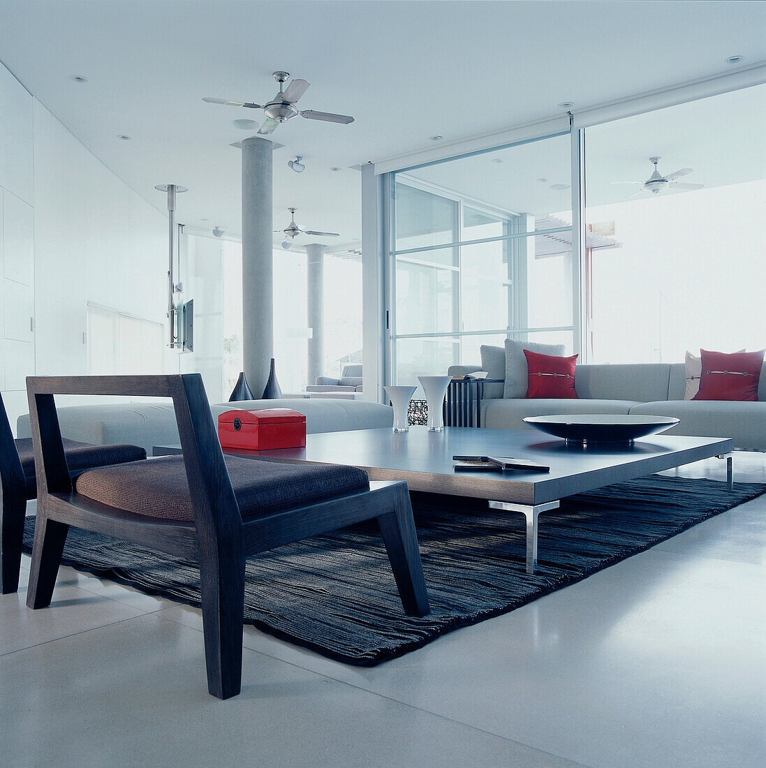 Sofas chairs and a large coffee table in a contemporary open plan living room