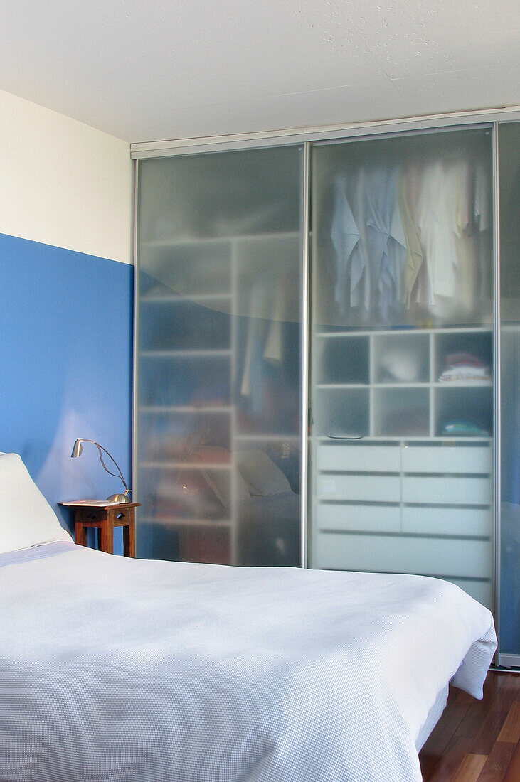 Emery glass wardrobes enlarge the look of a room