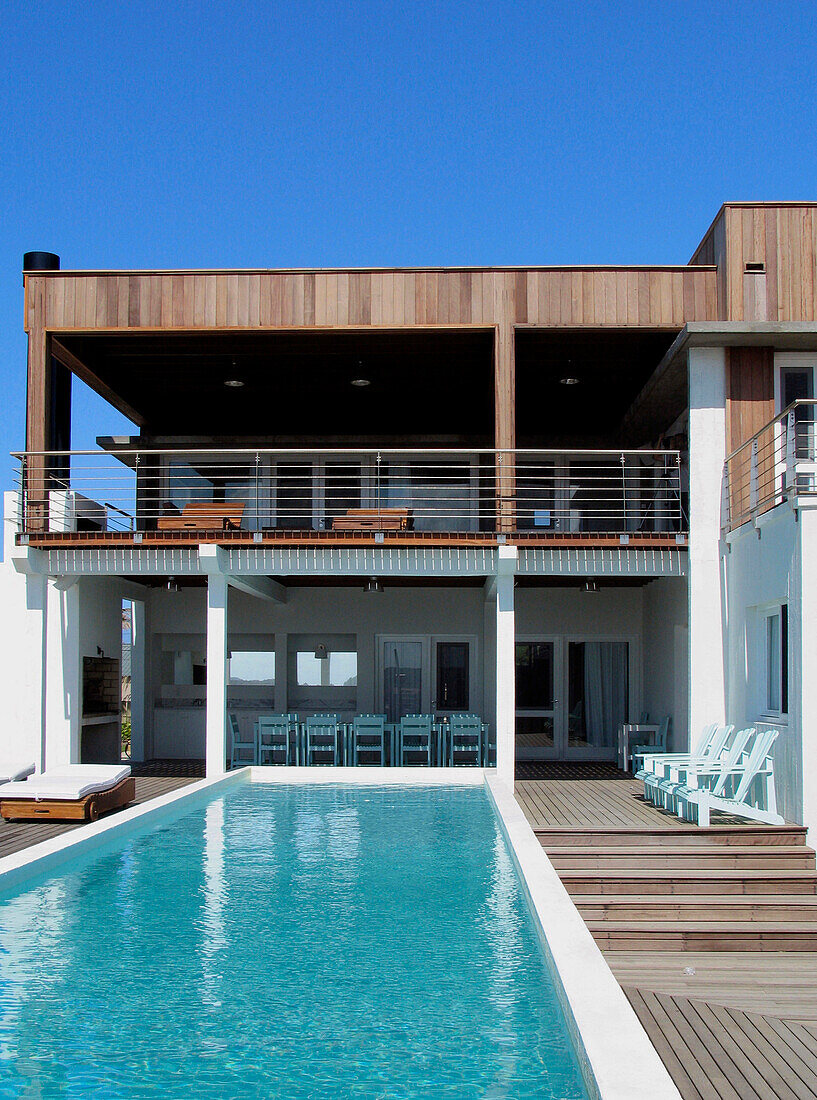 Holiday home exterior with swimming pool and balcony terrace