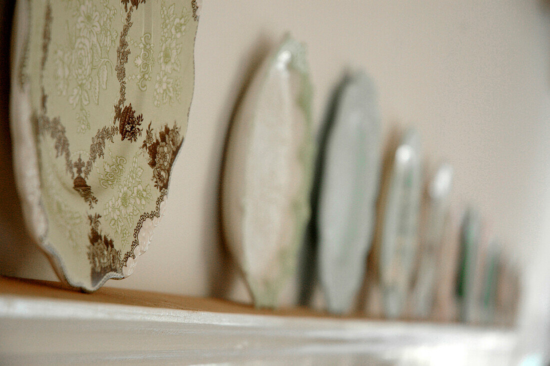 Decorative plates on shelf