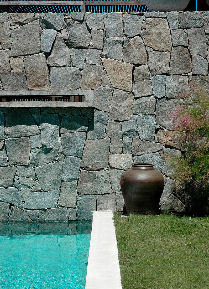 Dry stone wall at poolside exterior
