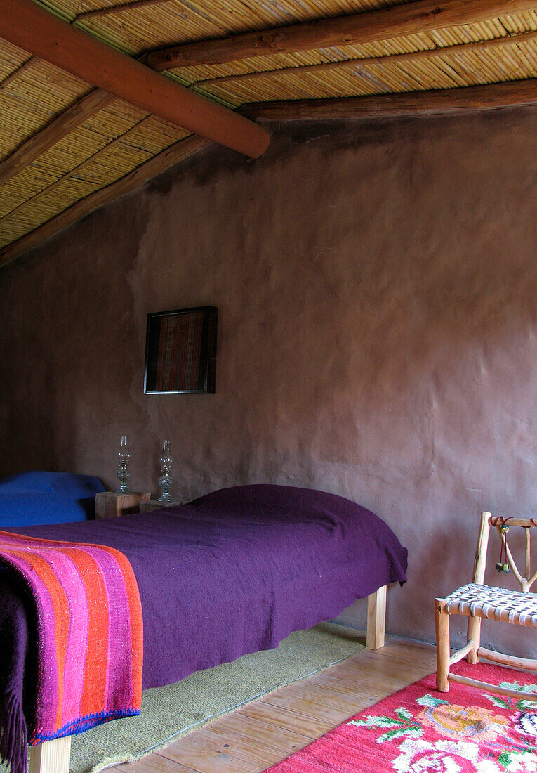 Rustic bedroom in stone built hut in JuJuy, Argentina
