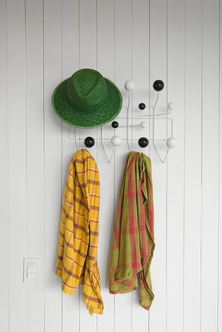 Uruguay, Manantiales, hat and scarves on hanger