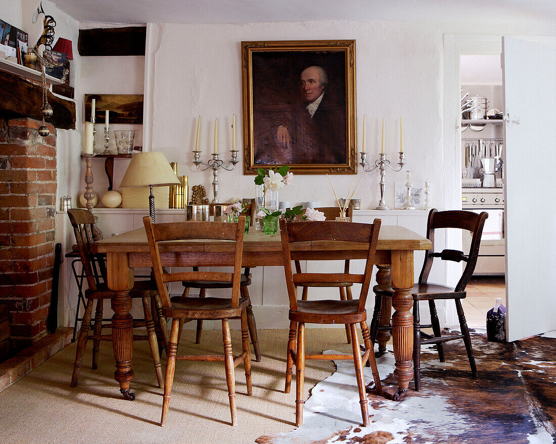 Wooden dining furniture below portrait in 17th Century Oxfordshire house