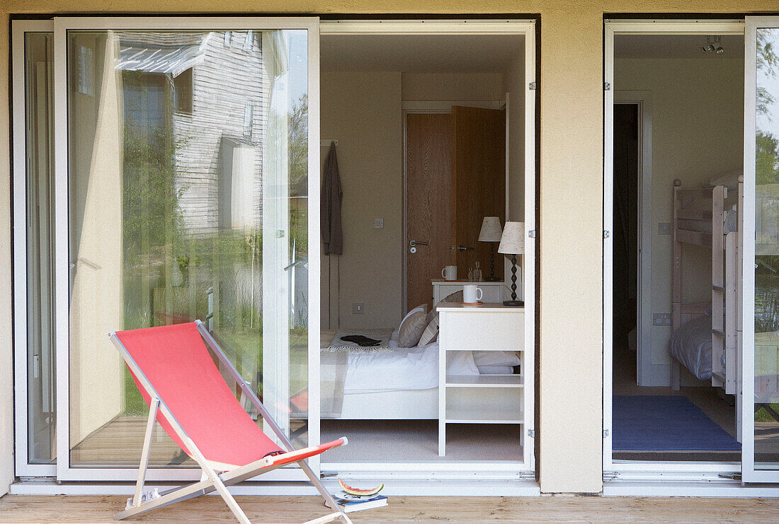 Deck chair with sliding doors of eco house bedroom exteriors