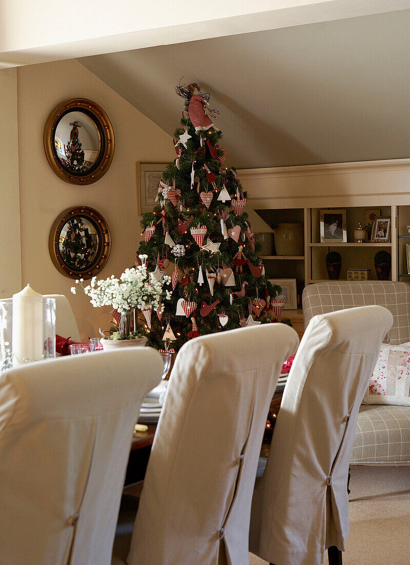 Christmas tree under slanted ceiling of farmhouse conversion
