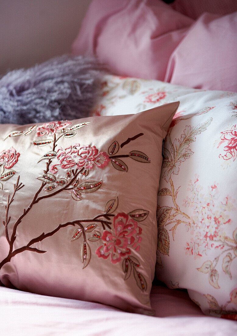 Embroidered cushions contrasting fabric