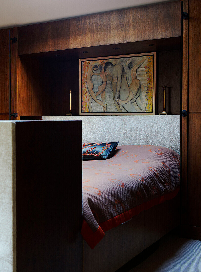 Modern art in panelled bedroom 
