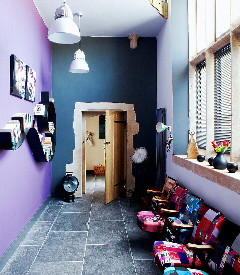 Blue and purple contrasting walls in reception room of Richmond school church conversion