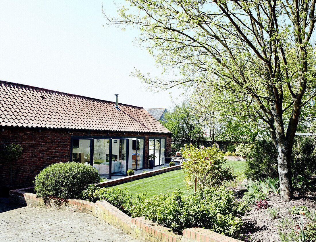 Barn conversion with brick driveway