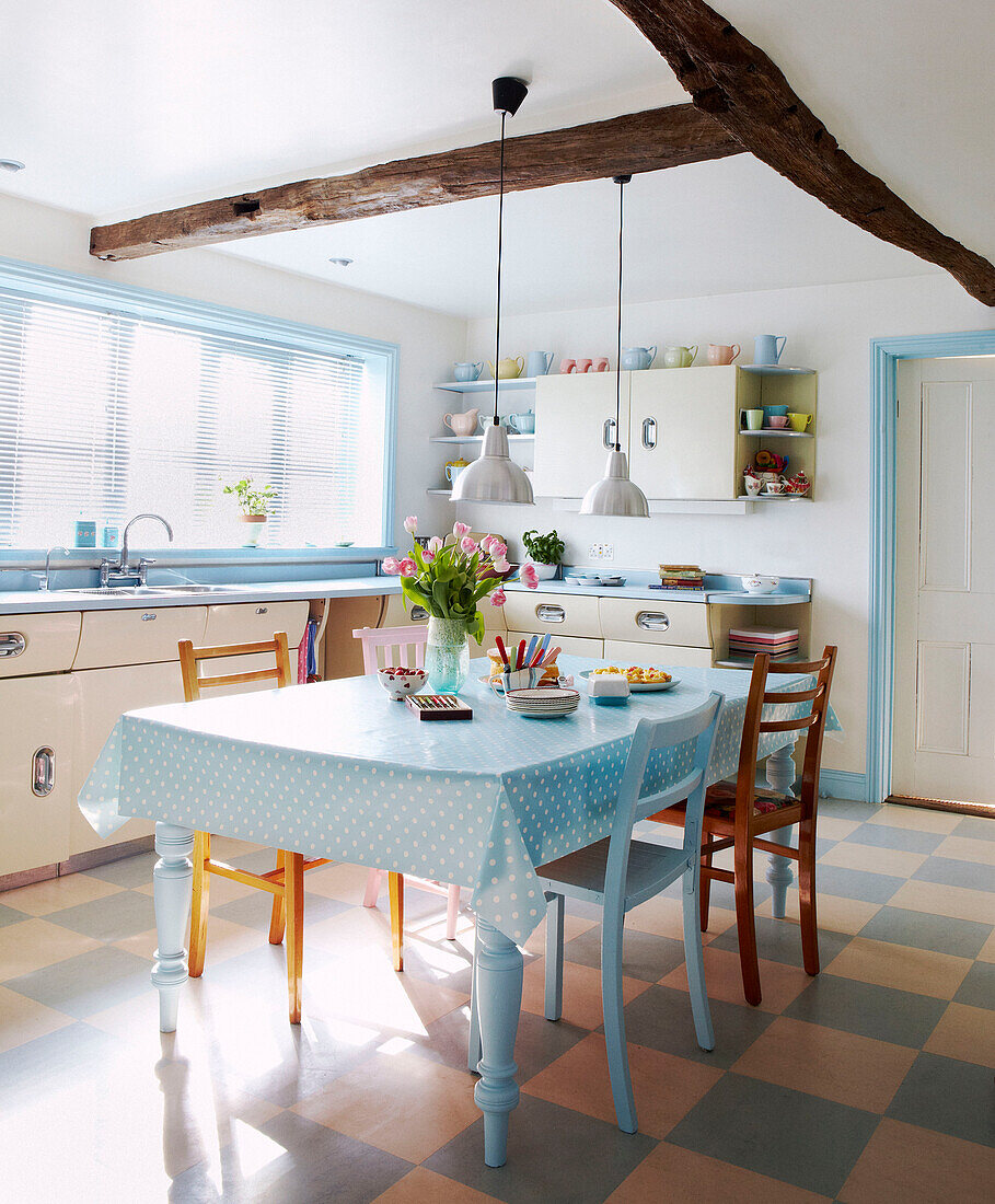 1950s kitchen with beamed ceiling in pastel blues