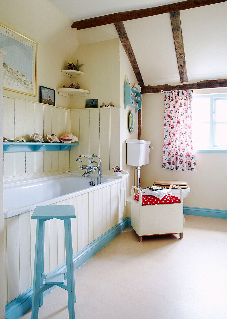 Panelled Norfolk bathroom with contrasting blue and cream paintwork