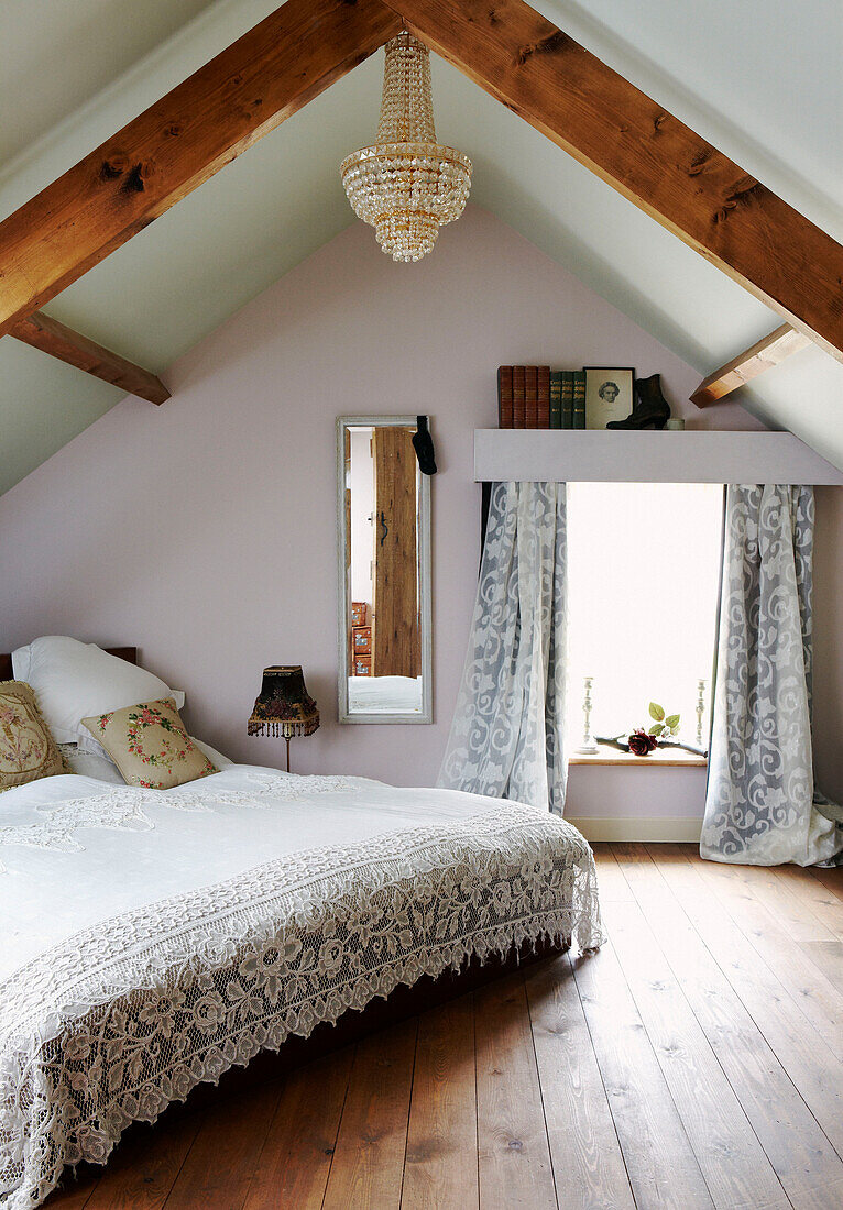 Lace bed cover in attic bedroom conversion