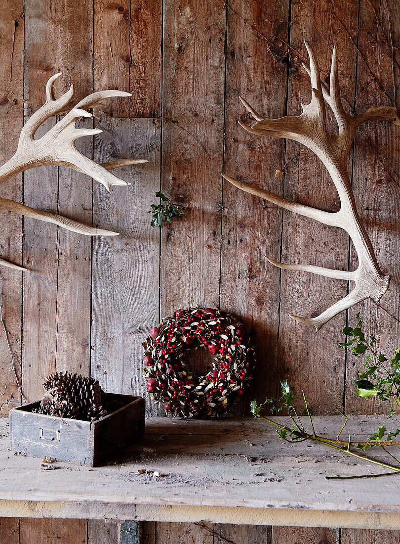 Antlers above work bench with Christmas decorations