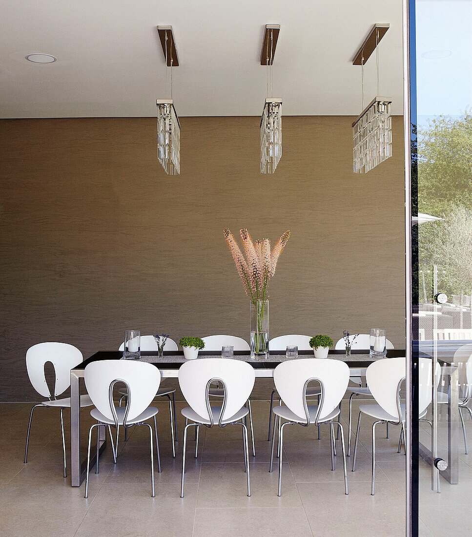 Dining room with ceiling lights and cut flowers