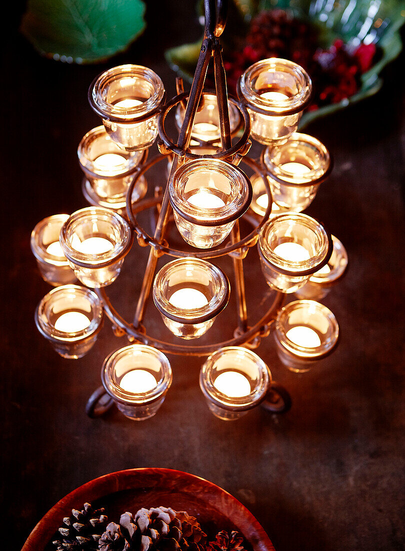 Lit tea lights on candle holder