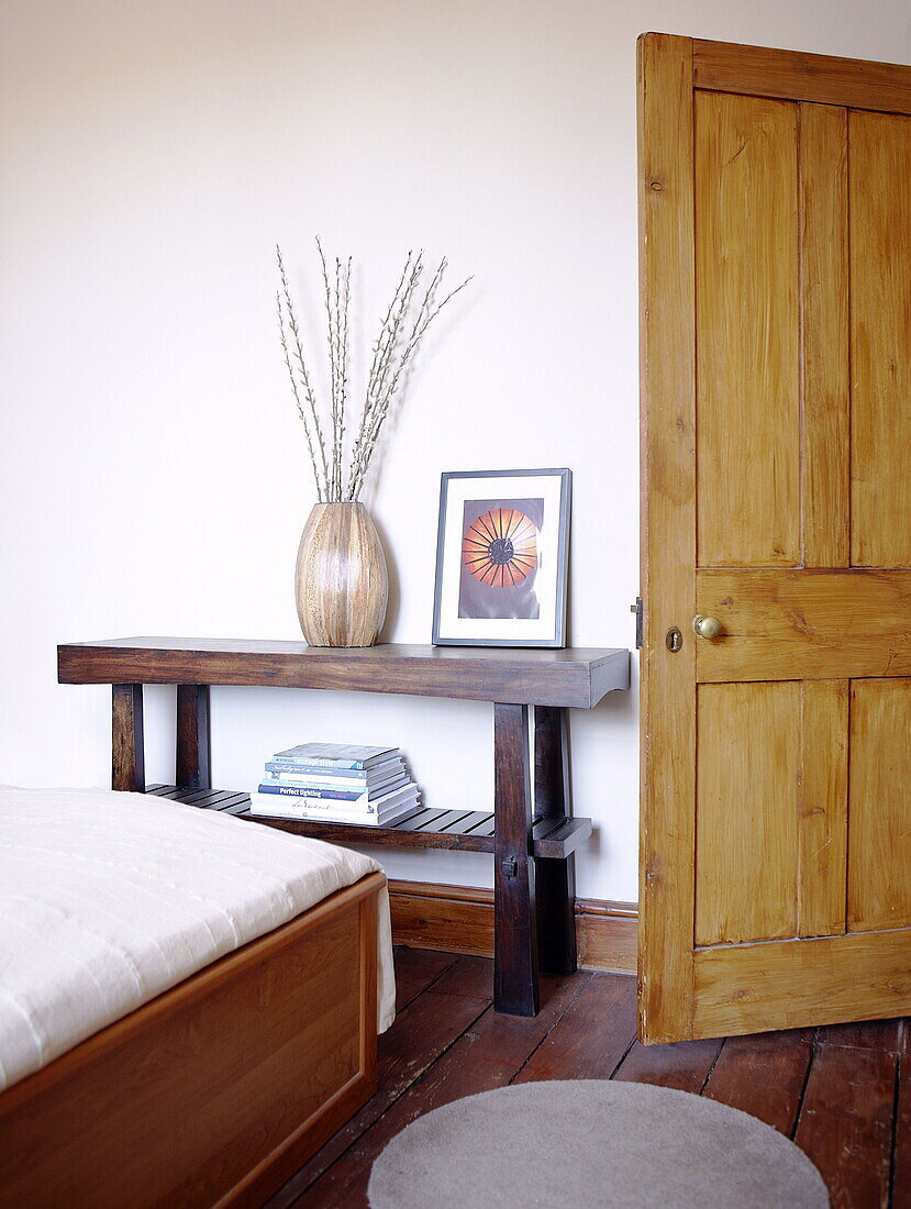 Wooden console table with twig arrangement bedroom detail City of Bath Somerset, England, UK
