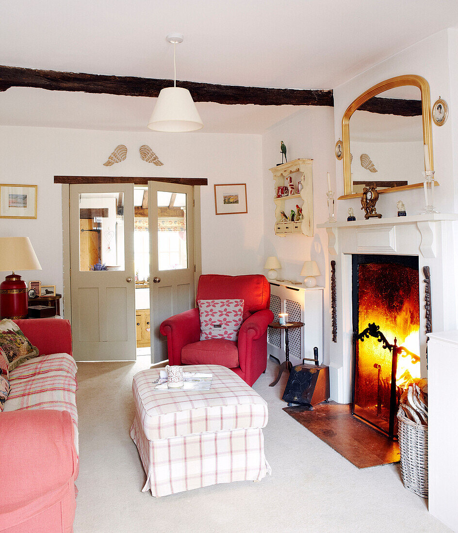 Ottoman stool at fireside of country home