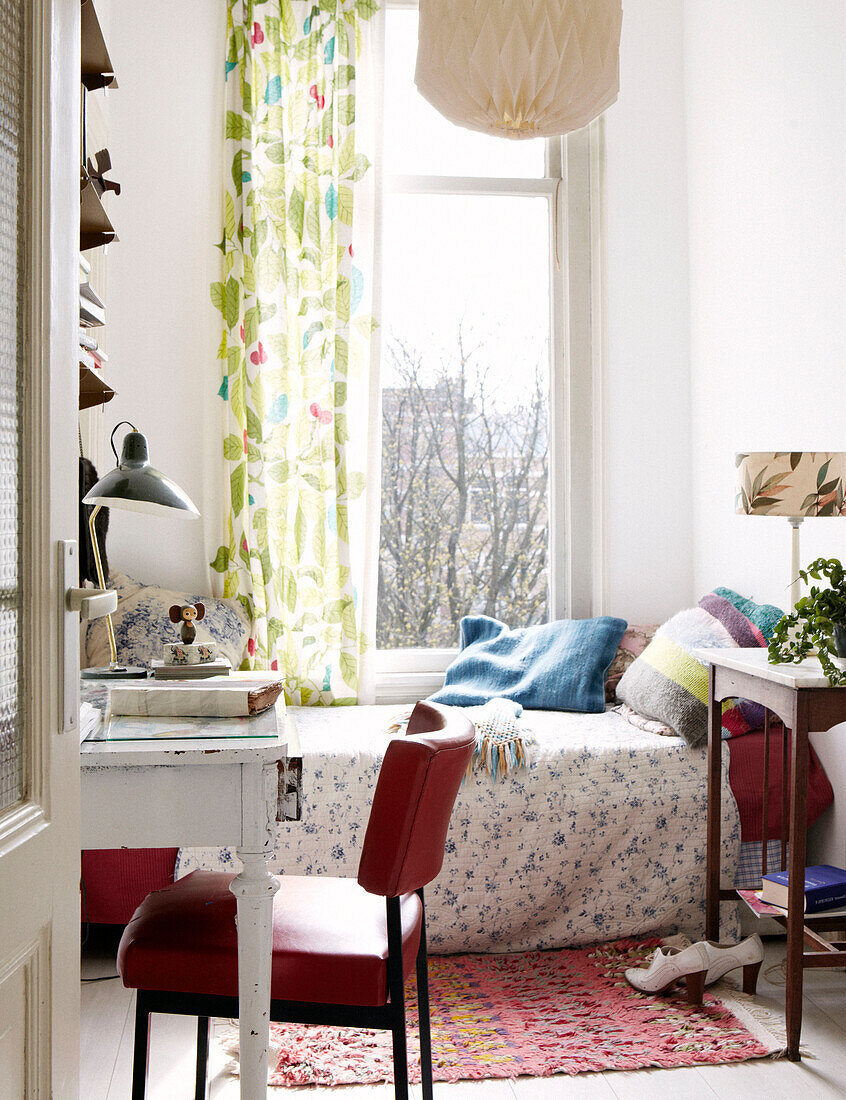 Single bed at window of contemporary apartment, Amsterdam, Netherlands